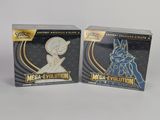 deux boîtes de cartes à collectionner Pokémon « Méga-Évolution » posées sur une surface blanche