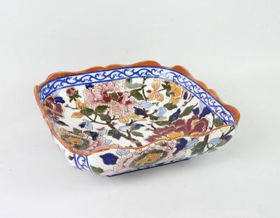 an image of a decorative bowl with flowers on it