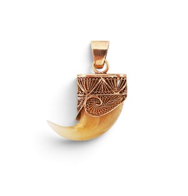 a close up of a pendant on a white surface