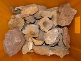 a large pile of rocks in a yellow container