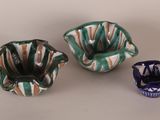 three small bowls and a small bowl on a table
