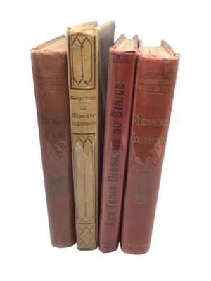 three books are stacked on top of each other on a white surface