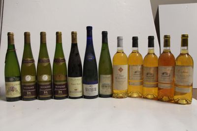 a lot of bottles of wine on the table