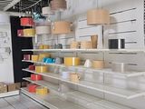 a blurry image of a store with shelves and shelves