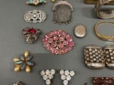 several different types of jewelry are displayed on a table