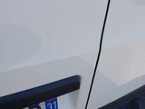 a close up of a car door handle with a sticker on it