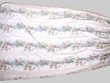 a picture of a white dress with a floral pattern on it