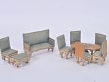 four chairs and a table in the middle of a room