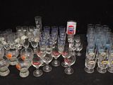 many glasses and a can of pepsi on the table