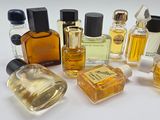 many different types of perfume bottles on a white surface