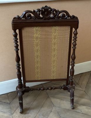 a chair that is sitting on the floor next to a wall