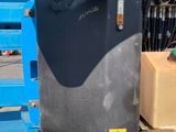 a man standing next to a truck with a box on the back