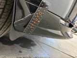 a close up of a car with a measuring tape on it
