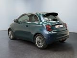 the back of a small blue car parked in a room