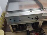 an image of a commercial gas grill in a commercial kitchen