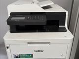 a white printer sitting on top of a wooden box