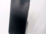 an image of a cell phone sitting on top of a white surface