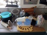 a kitchen counter with a lot of cooking utensils on it