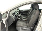 the interior of a car with the door open and the driver ' s seat up