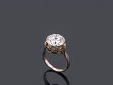 an image of a diamond ring on a black surface