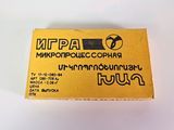 a close up of a yellow business card on a white surface
