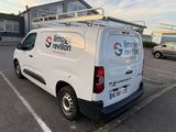 a white van that is parked in a parking lot