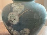 a vase that is sitting on a table in a room