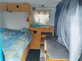 two beds in the back of a camper van