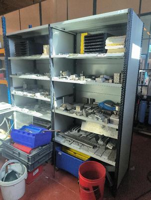 many shelves with various items on them in a room