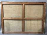 an old wooden window frame with four panes of burlock cloth