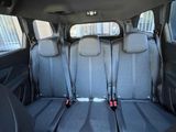 four seats in the back of a car that are empty