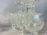 a lot of empty wine glasses sitting on a table