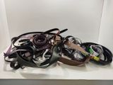 a white box with a bunch of belts on it