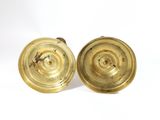 pair of antique brass candlesticks on a white background