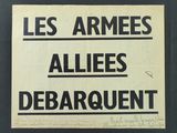 an image of a black and white sign that says les armees allies debarquent