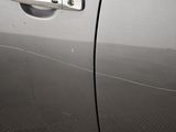 an image of a car door handle with a sticker on it
