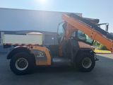 a picture of a forklift truck parked in front of a building