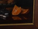 a painting of oranges and cookies on a table
