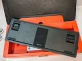 a black and orange box with a cell phone inside of it