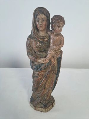 statue of a woman holding a child in her arms