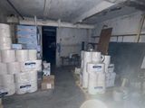 many rolls of toilet paper stacked on the floor