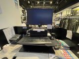 a laptop computer sitting on a desk in a store