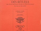 un livre orange intitulé « Origine et évolution des rites »