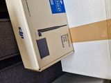 a person holding a box that is open on the stairs
