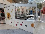 an image of a fruit stand inside of a mall