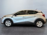 the silver car is parked in a room with a white wall
