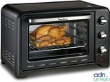 une photo d'un four grille-pain contenant un poulet rôti