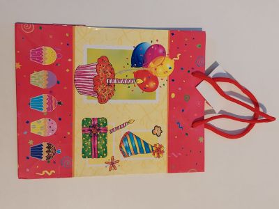 a card with a picture of a birthday cake and a pair of scissors