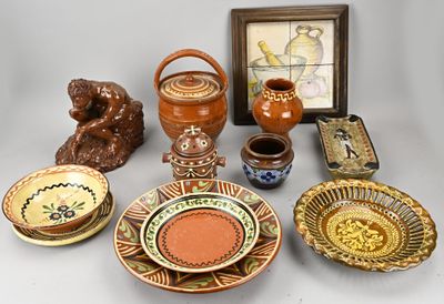 many different types of pottery displayed on the table