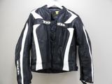 a black and white leather jacket hanging on a hanger